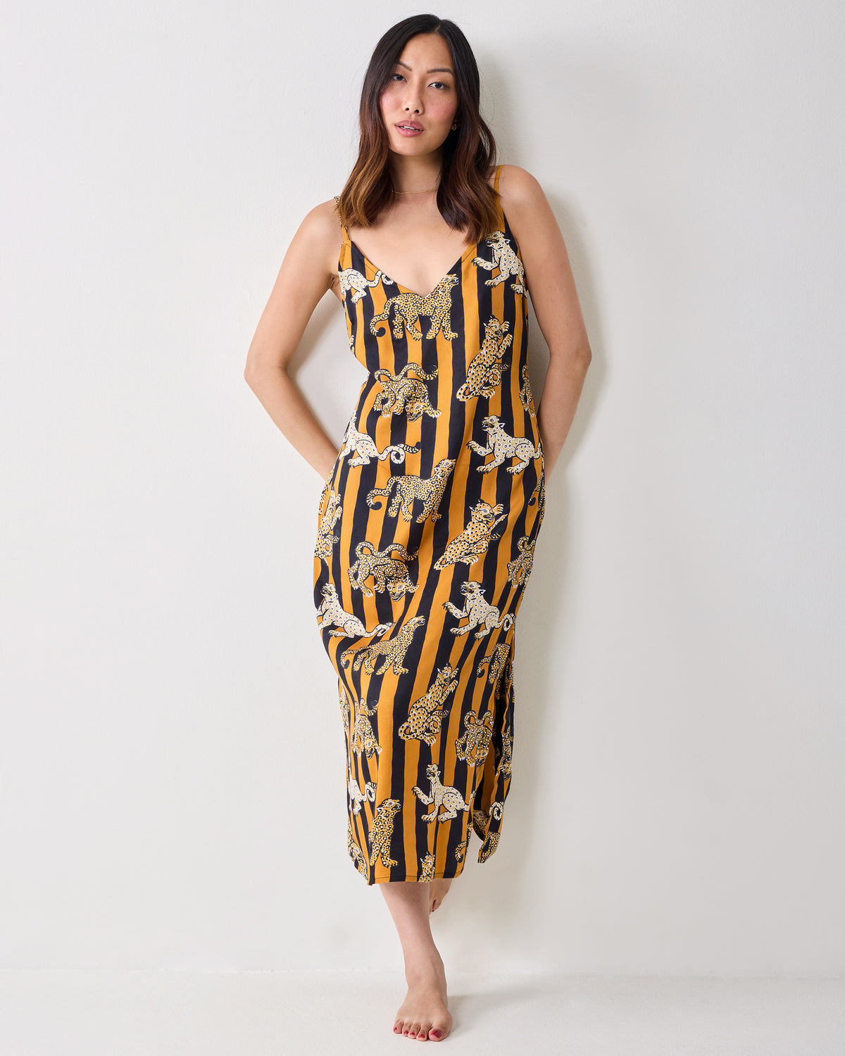 Full-length front view of a model wearing the Leopard Stripes Chic To Sleep nightie with thin shoulder straps and leopard print.