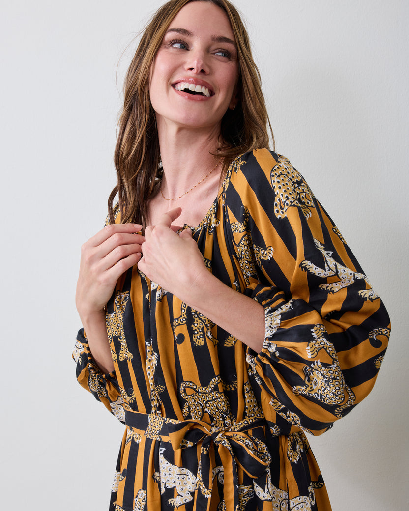 Close front view of the Leopard Stripes Felicity dress showing the gathered neckline, waist tie, and leopard stripe print.