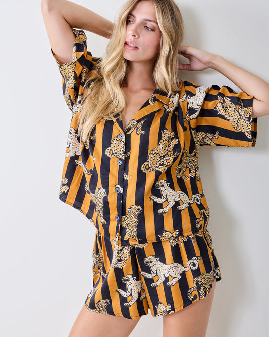 Front view of the striped leopard-print pajama set with a short-sleeve button-front top and shorts.