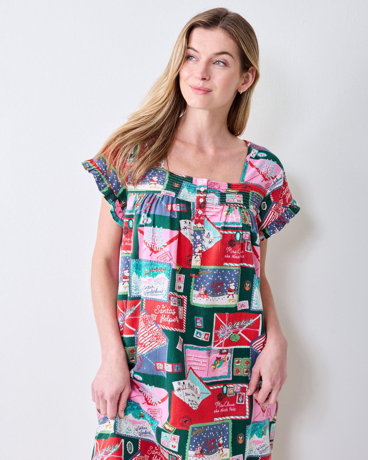 Front view of the Letters to Santa printed daylight nightgown with a square neckline, buttoned bodice, and ruffled sleeves.