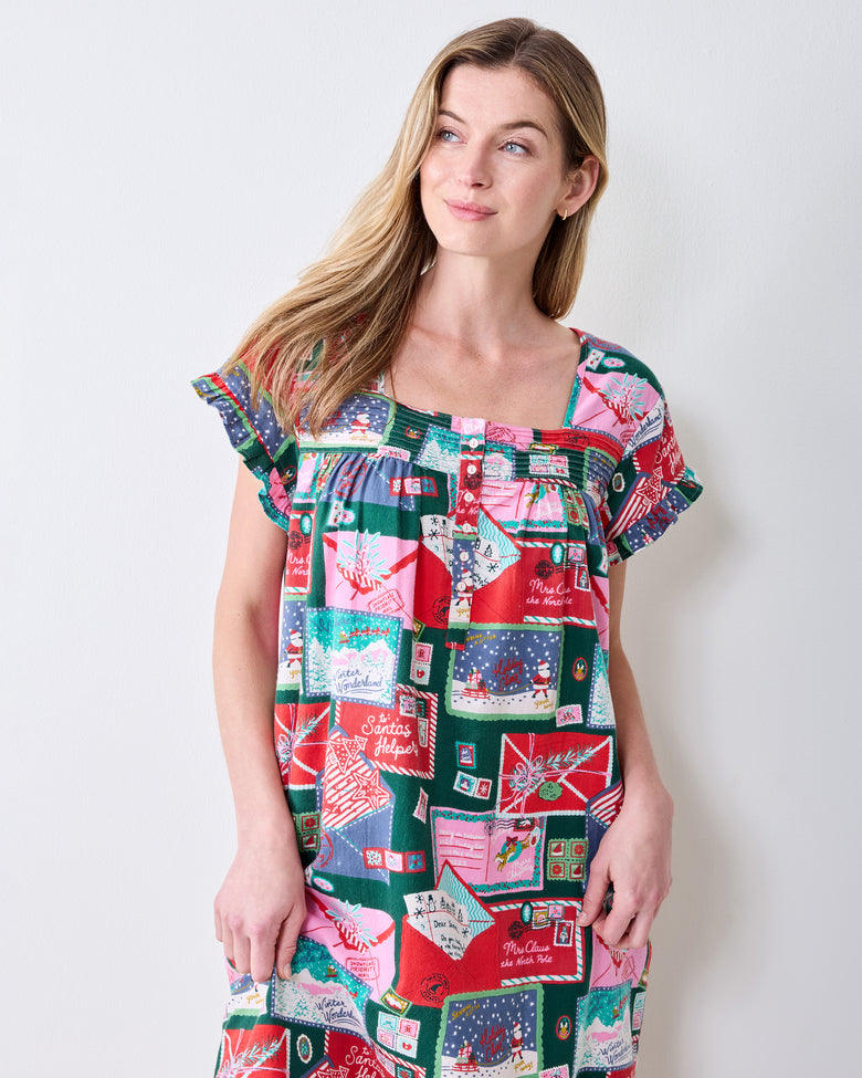 Front view of the Letters to Santa printed daylight nightgown with a square neckline, buttoned bodice, and ruffled sleeves.