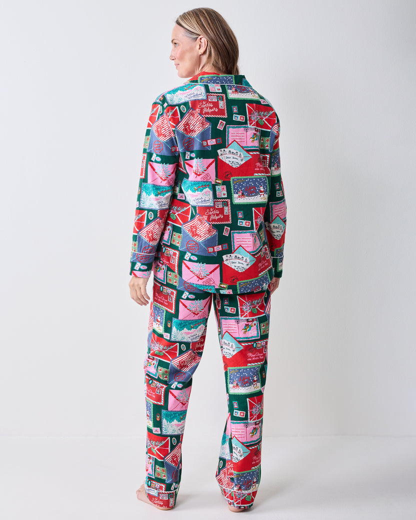 Back view of the Letters to Santa long pajama set showing the shirt and matching pants covered in postcard-style print.