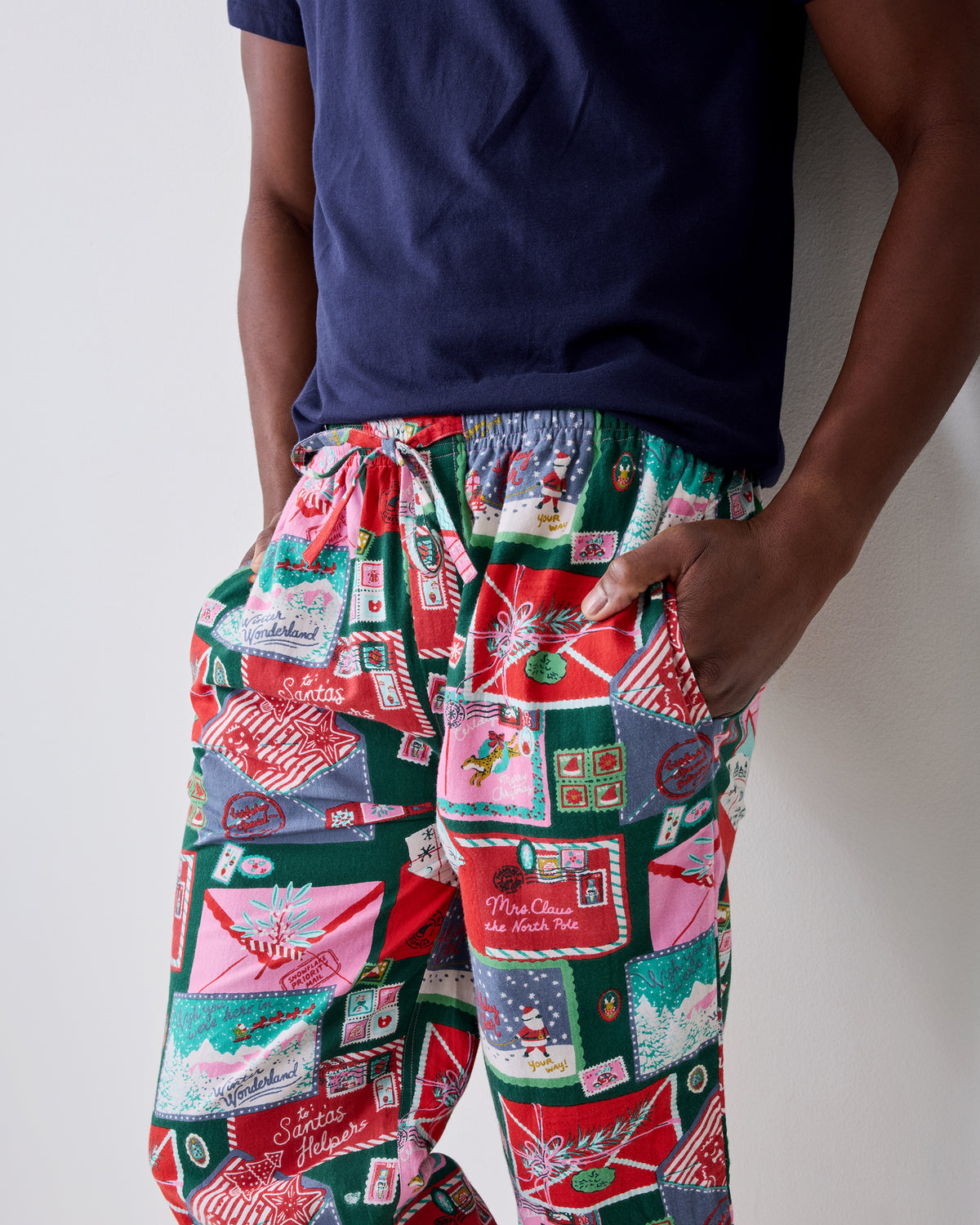 Close front view of the printed pajama pants, showing the elastic drawstring waist and side pockets.