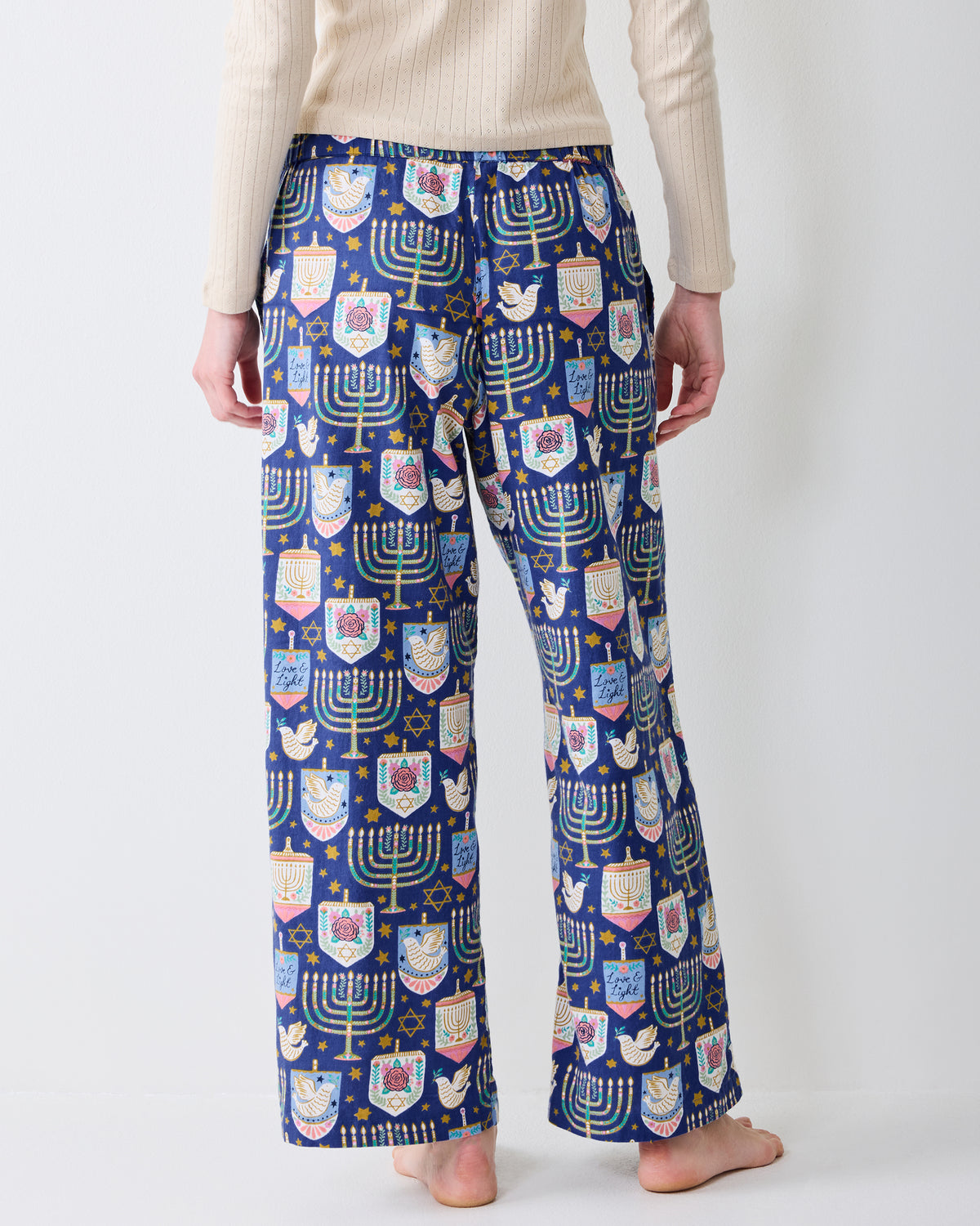 Back view of Hanukkah Blue Astrid wide-leg pajama pants showing the full rear pattern and straight hems.