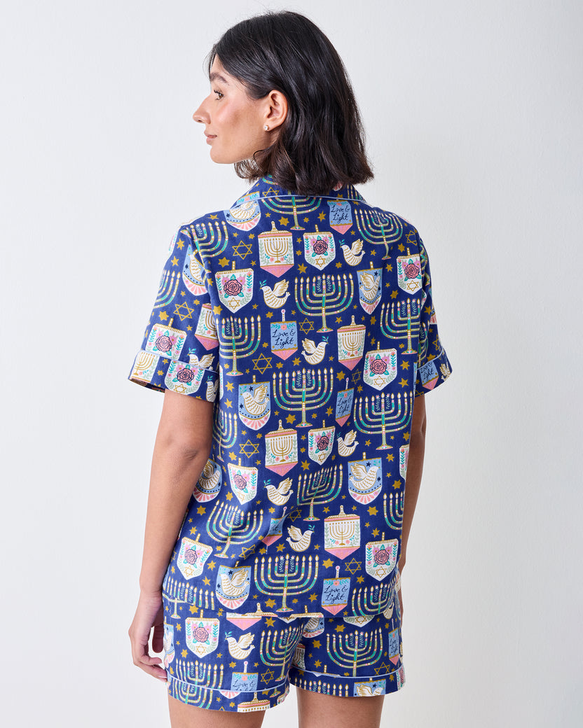 Back view of the blue patterned short pajama set, showing the short-sleeved top and matching shorts.