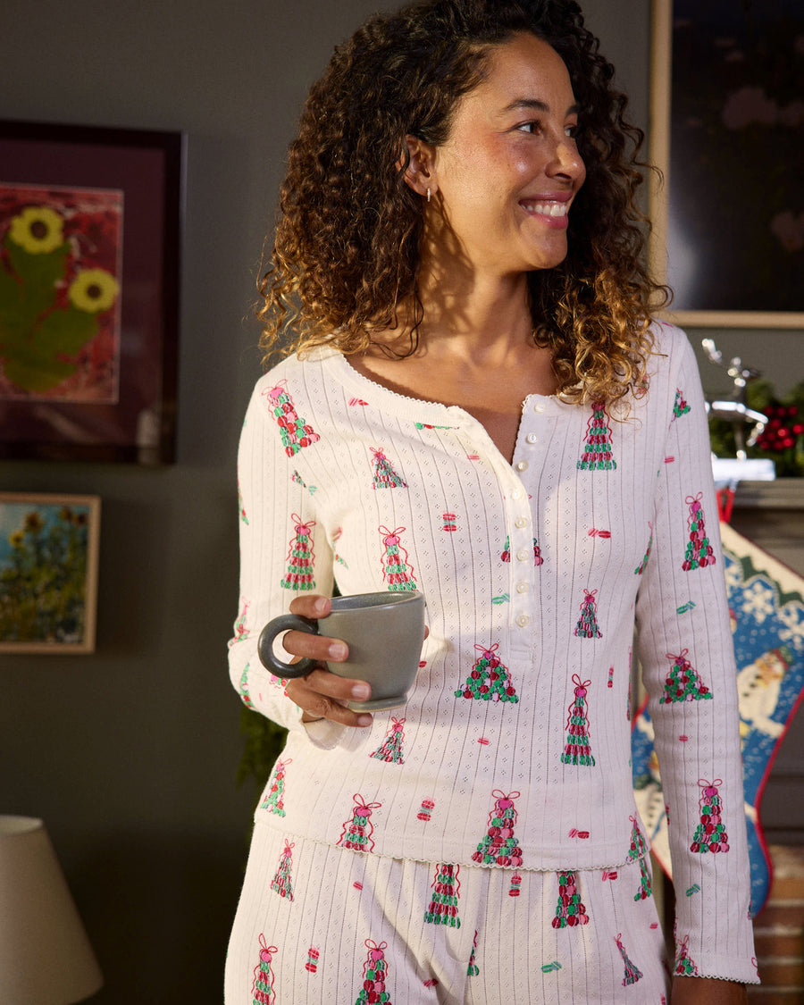 Close-up of the buttercream Macaron Tower Kaylee pajama top showing its button front, long sleeves, and colorful dessert-themed print.
