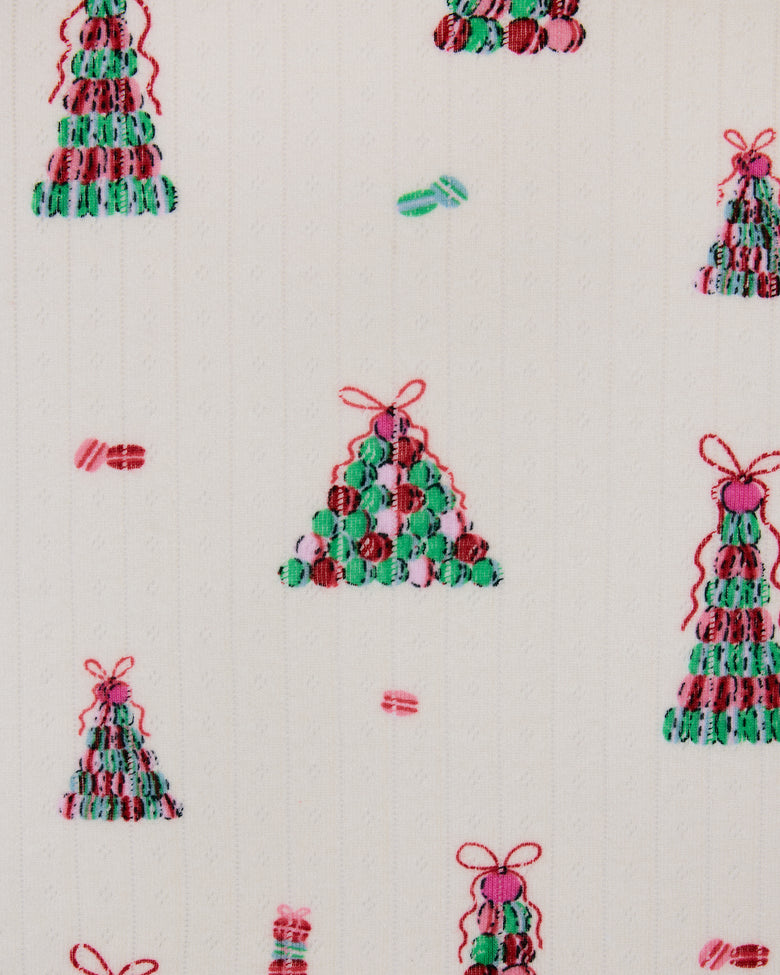 Buttercream Macaron Tower print with small multicolored Christmas trees and bows