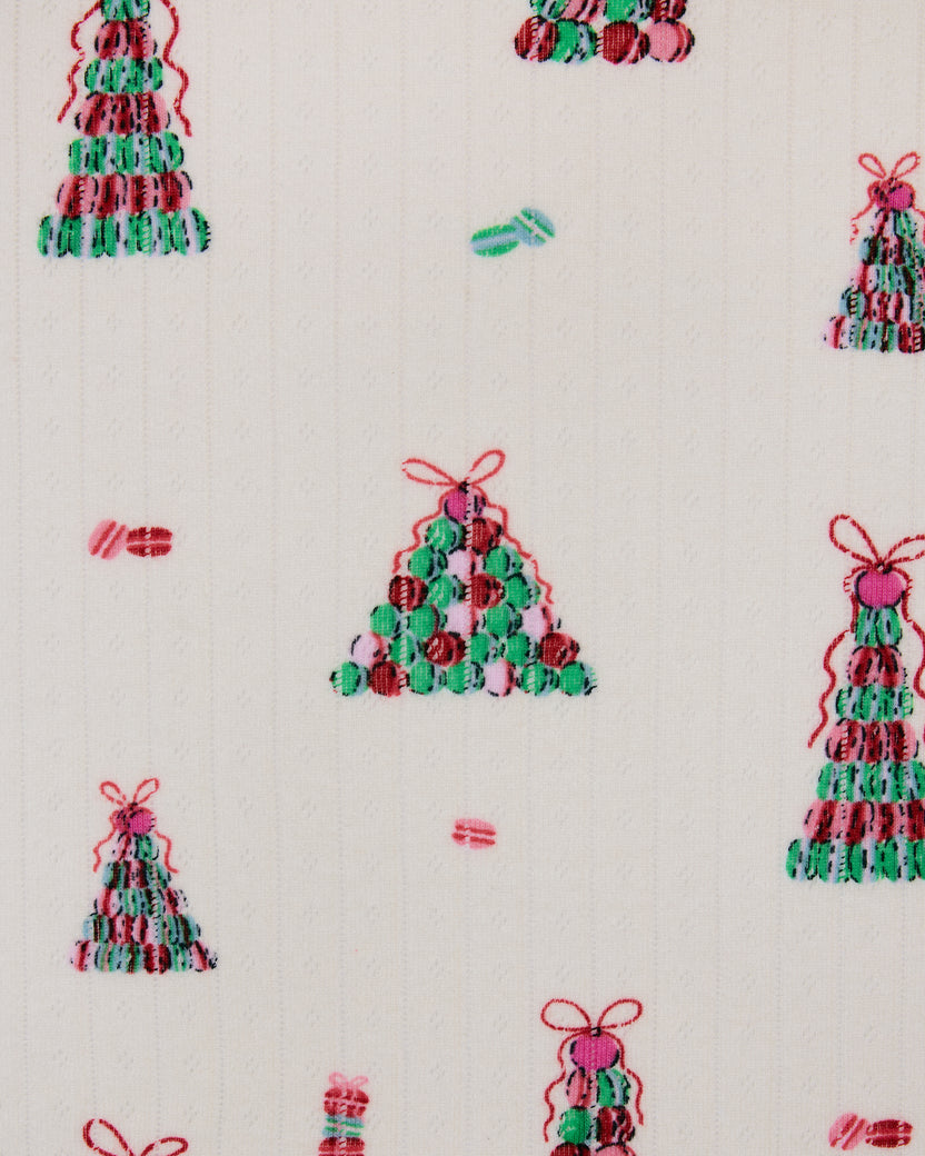Buttercream Macaron Tower print with small multicolored Christmas trees and bows
