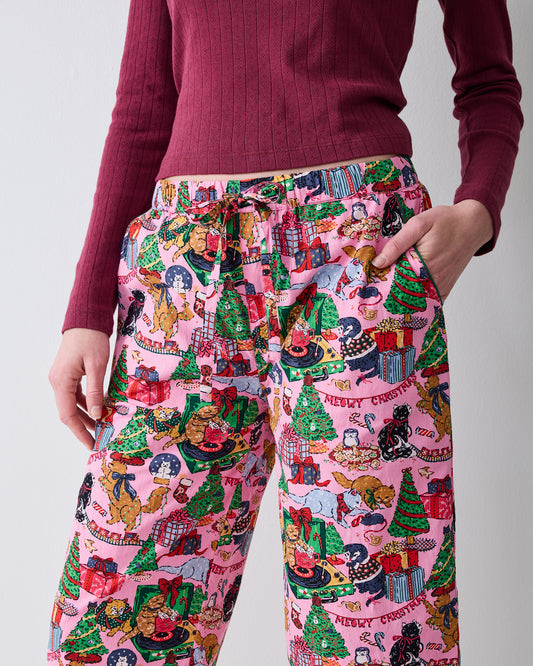Close-up of the Candy Pink Meowy Christmas cropped pajama pants, showing the drawstring waist, side pockets, and printed design.