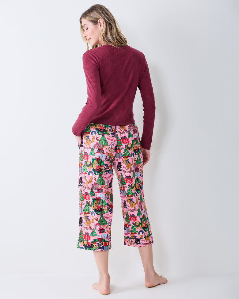 Back view of the Candy Pink Meowy Christmas cropped pajama pants, showing the ankle-length cropped cut and printed design.