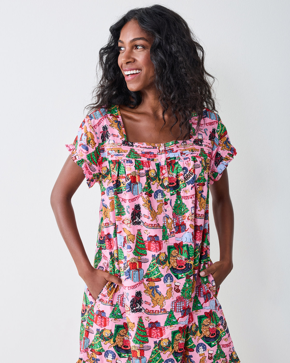 Front detail of the Candy Pink Meowy Christmas pintuck nightgown, showing the square neckline, front buttons, gathered yoke, and side pockets.