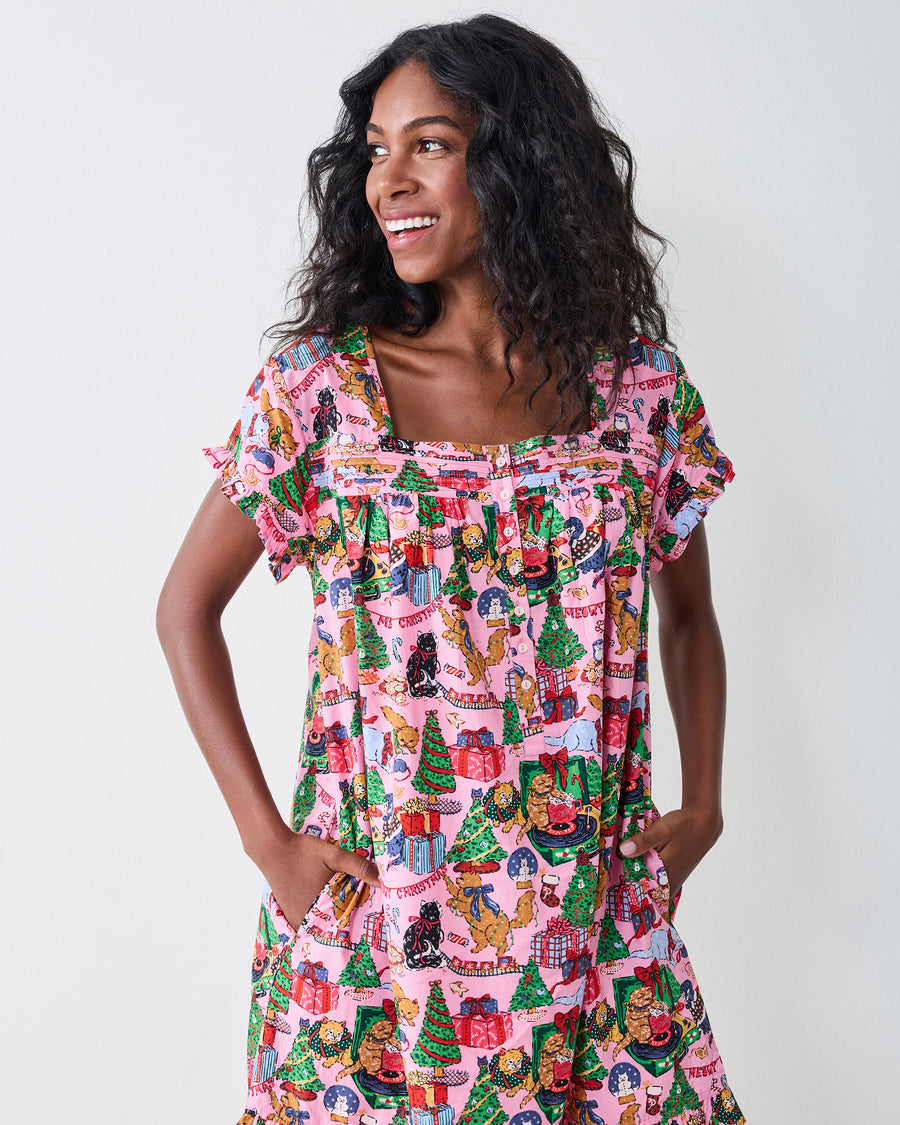 Front detail of the Candy Pink Meowy Christmas pintuck nightgown, showing the square neckline, front buttons, gathered yoke, and side pockets.