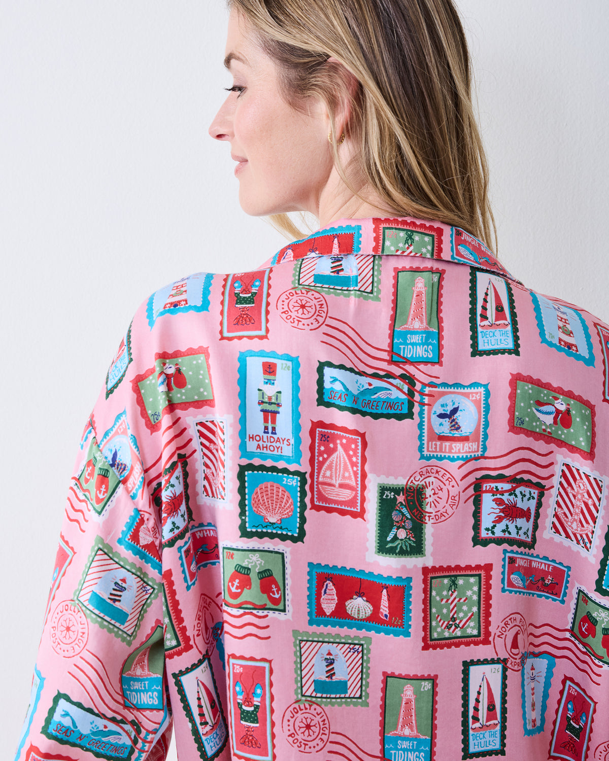 Back view close-up of the pink Nautical Stamps pajama shirt showing the collar, shoulders, and nautical postage-stamp print.