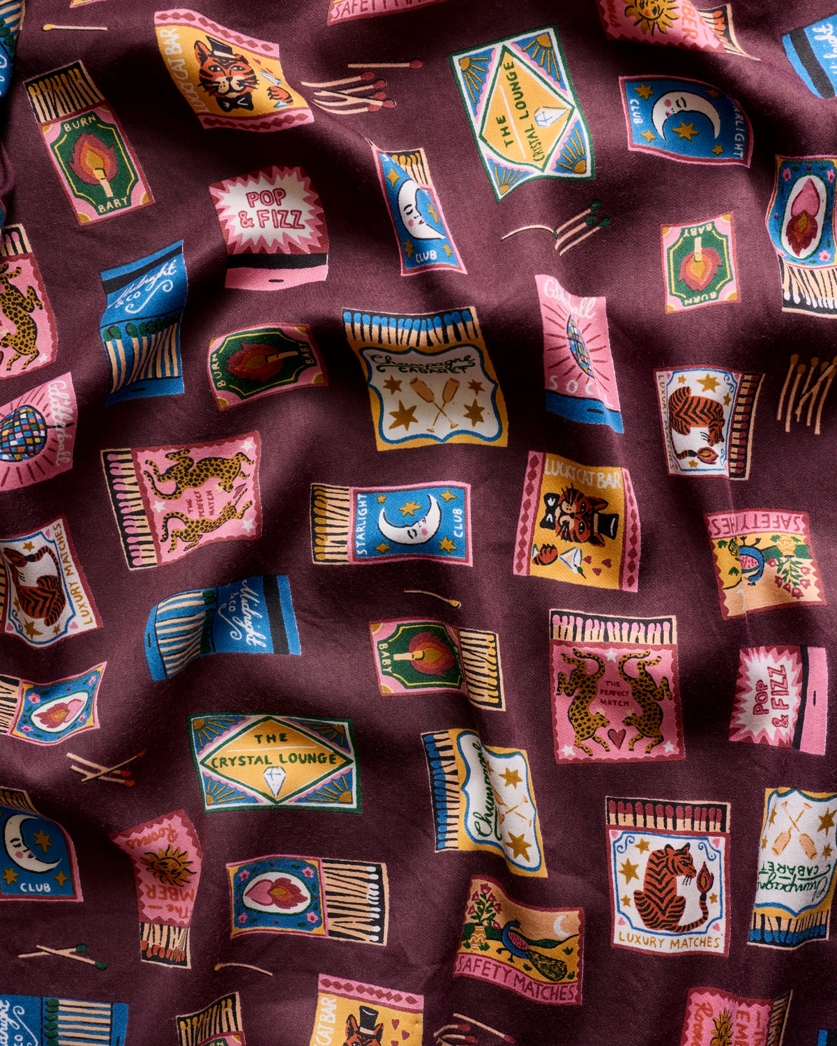 Close-up of the Painted Matchbook print on the Cabernet tall pajama set.
