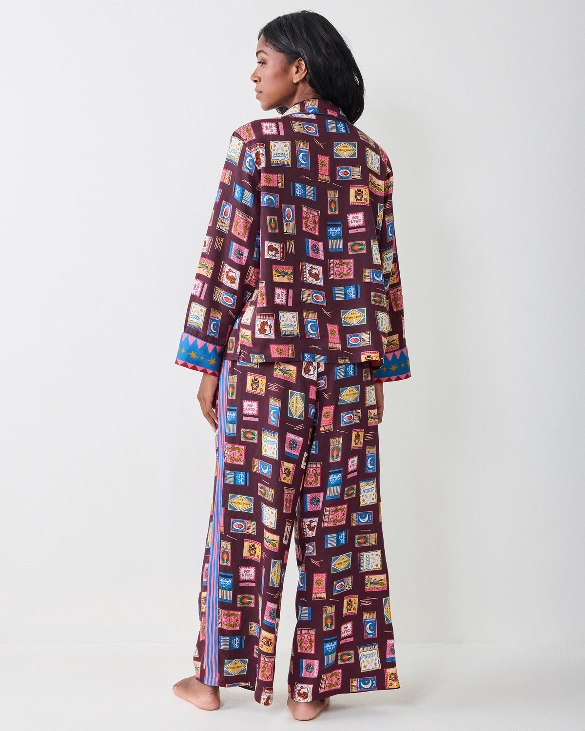 Back view of the Painted Matchbook Cabernet pajama set, showing the full back print and striped side detail on the pants.