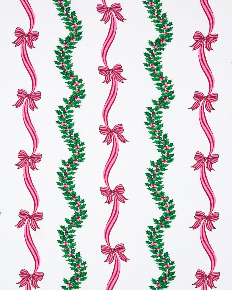 Flat view of the Ribbons & Bows Vanilla Cream print, showing repeated vertical green garlands and pink ribbon bows.