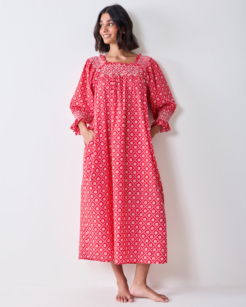 Front view of the red patterned Parker nightgown on a person, showing its long loose silhouette and long sleeves