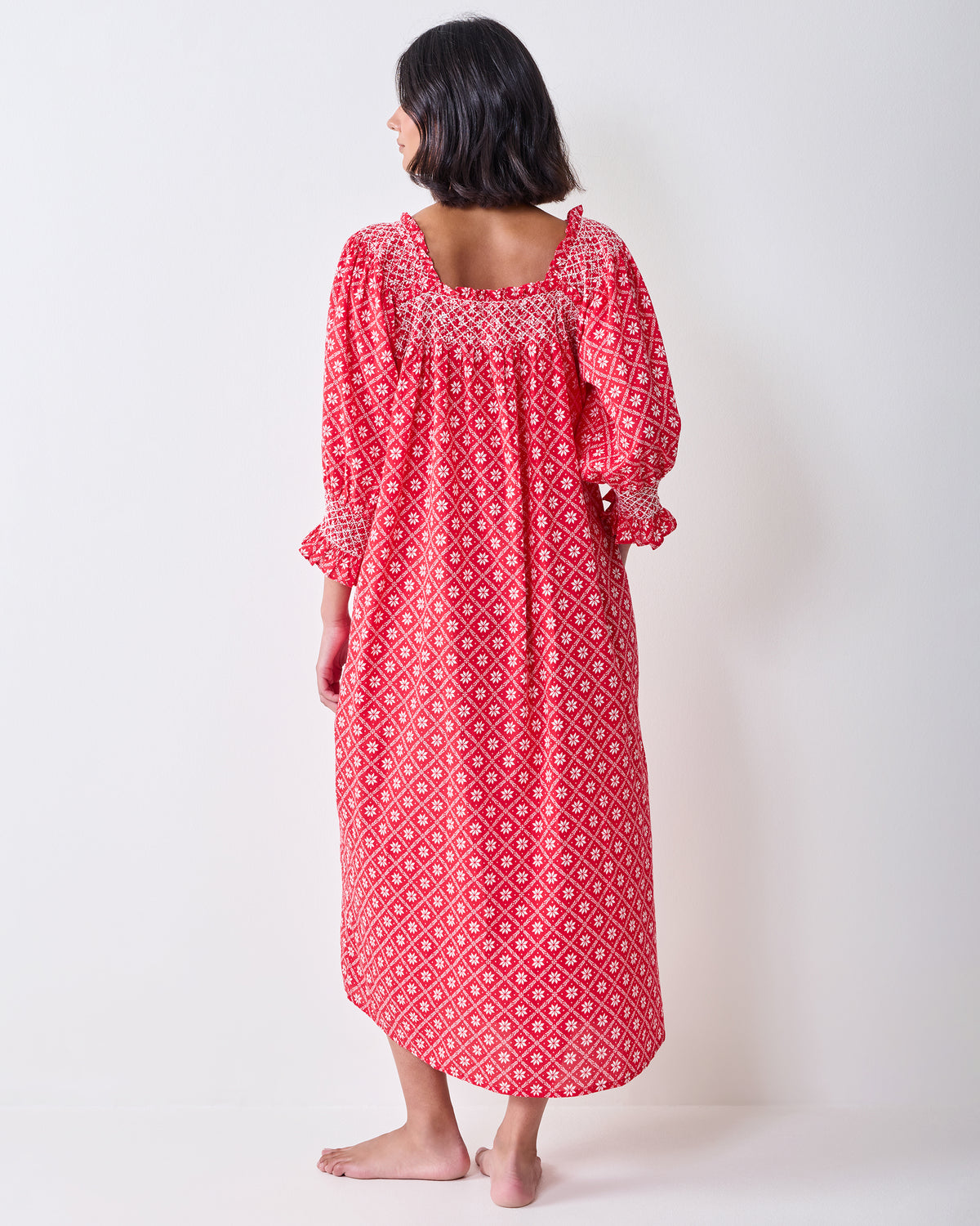 Back view of the red patterned Parker nightgown, showing the square neckline and long loose silhouette