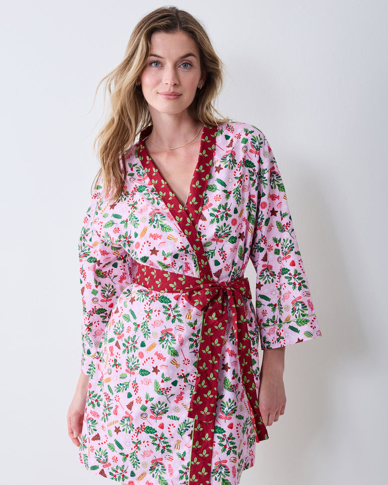 Front view of the Sweet Tooth Getting Ready Robe in Candy Pink, with a pink printed wrap robe, red contrasting trim, and a tied waist belt.