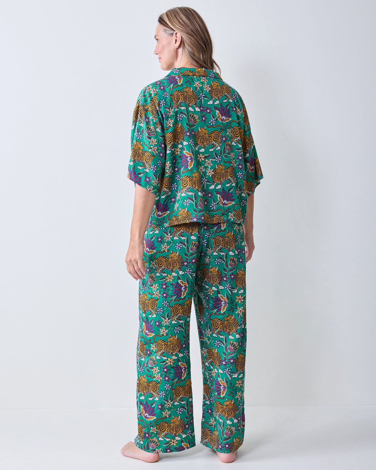 Back view of the Royal Teal Wildest Dreams shirt and wide-leg pants set, showing the matching tiger-and-floral print.