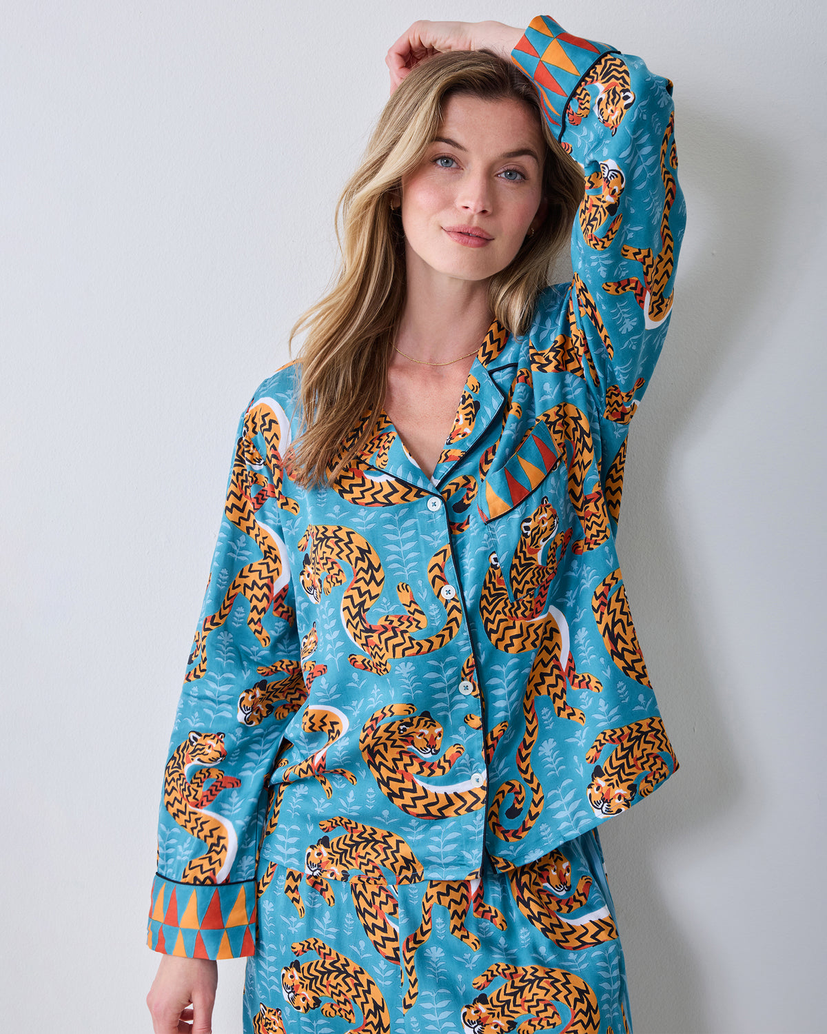 Twisted Tiger Rittenhouse pajama set in Persian turquoise with orange tiger print, shown from the front.