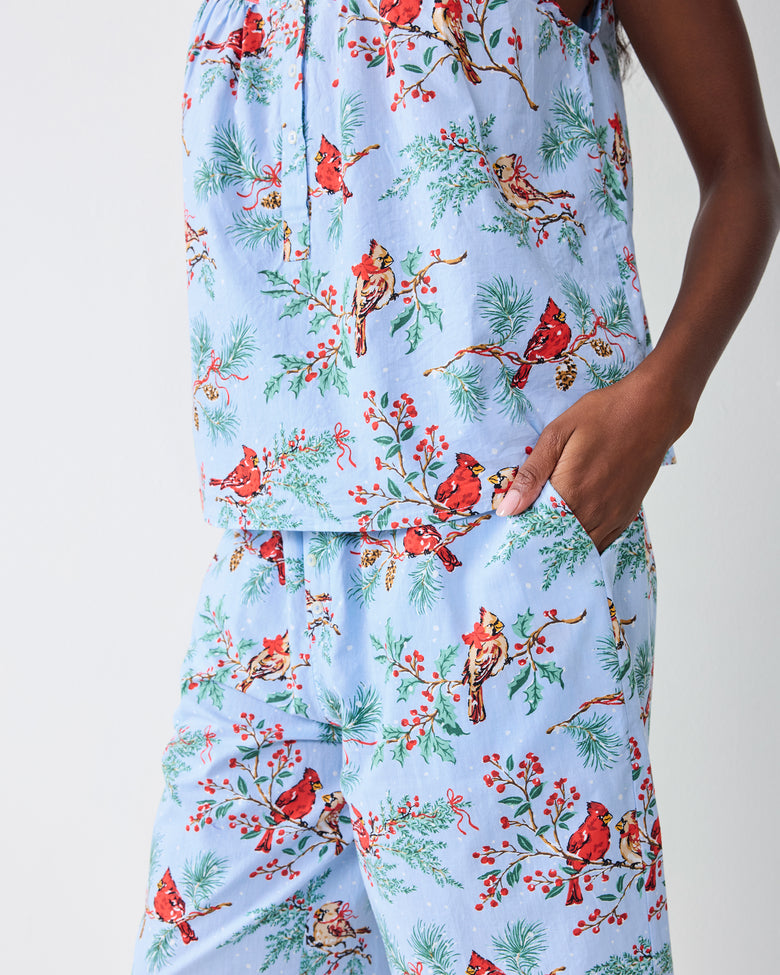Detail view of the frosted blue cropped pants set showing the printed camisole hem and cropped pants with a side pocket.