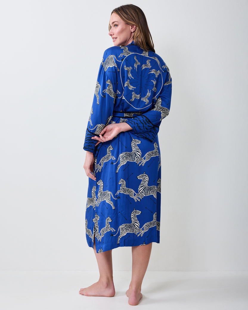 Back view of a denim-blue zebra-print robe with a tied waist.