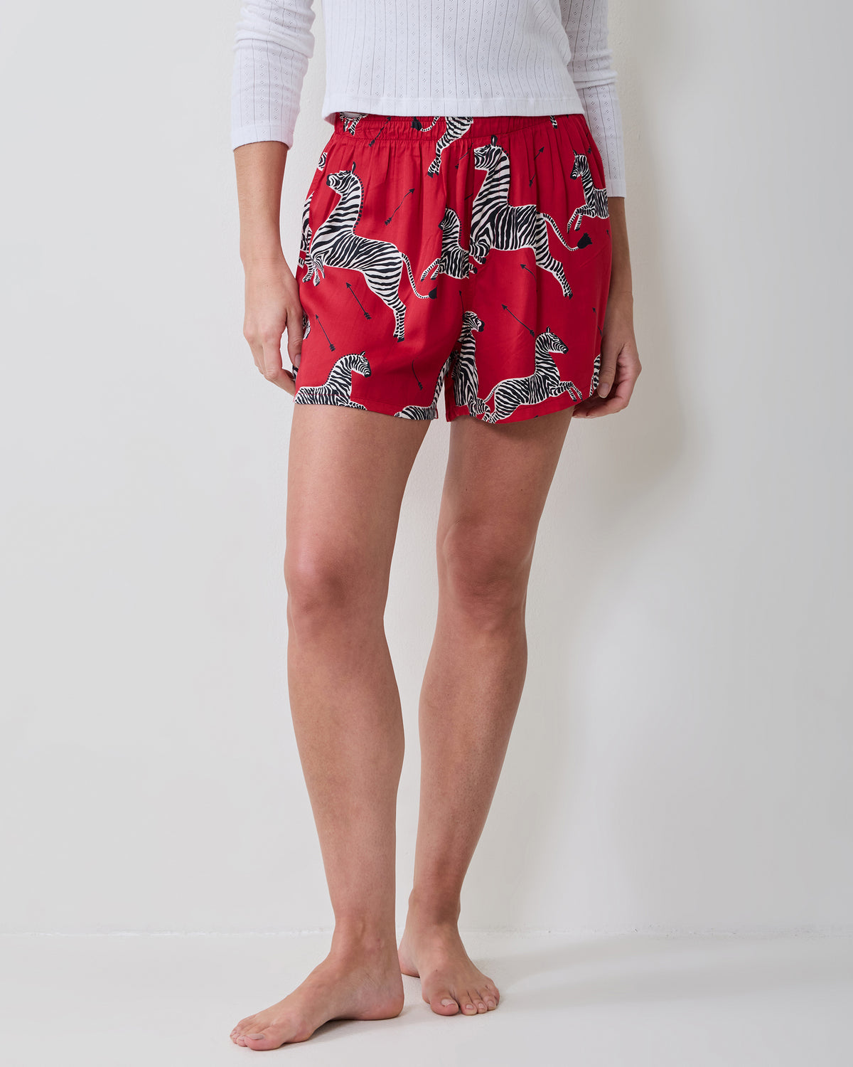 Front view of red boxer shorts with an elastic waistband and black-and-white zebra print.