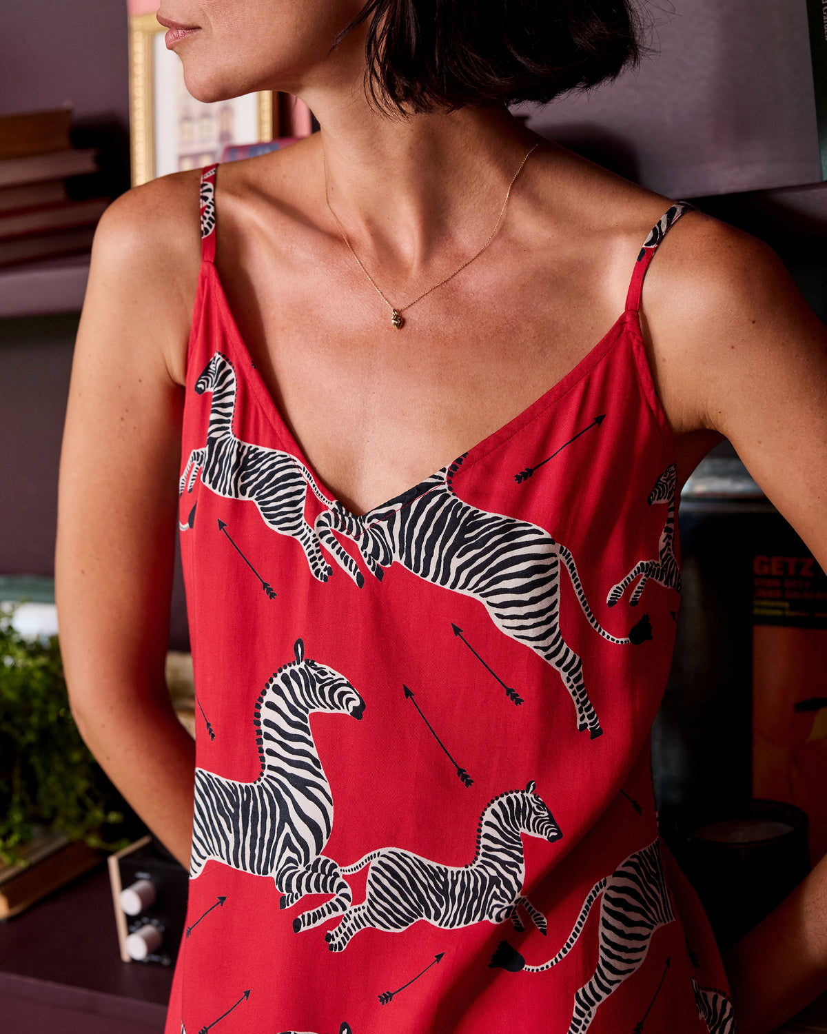 Close-up of the red zebra-print nightie showing its thin straps and neckline.