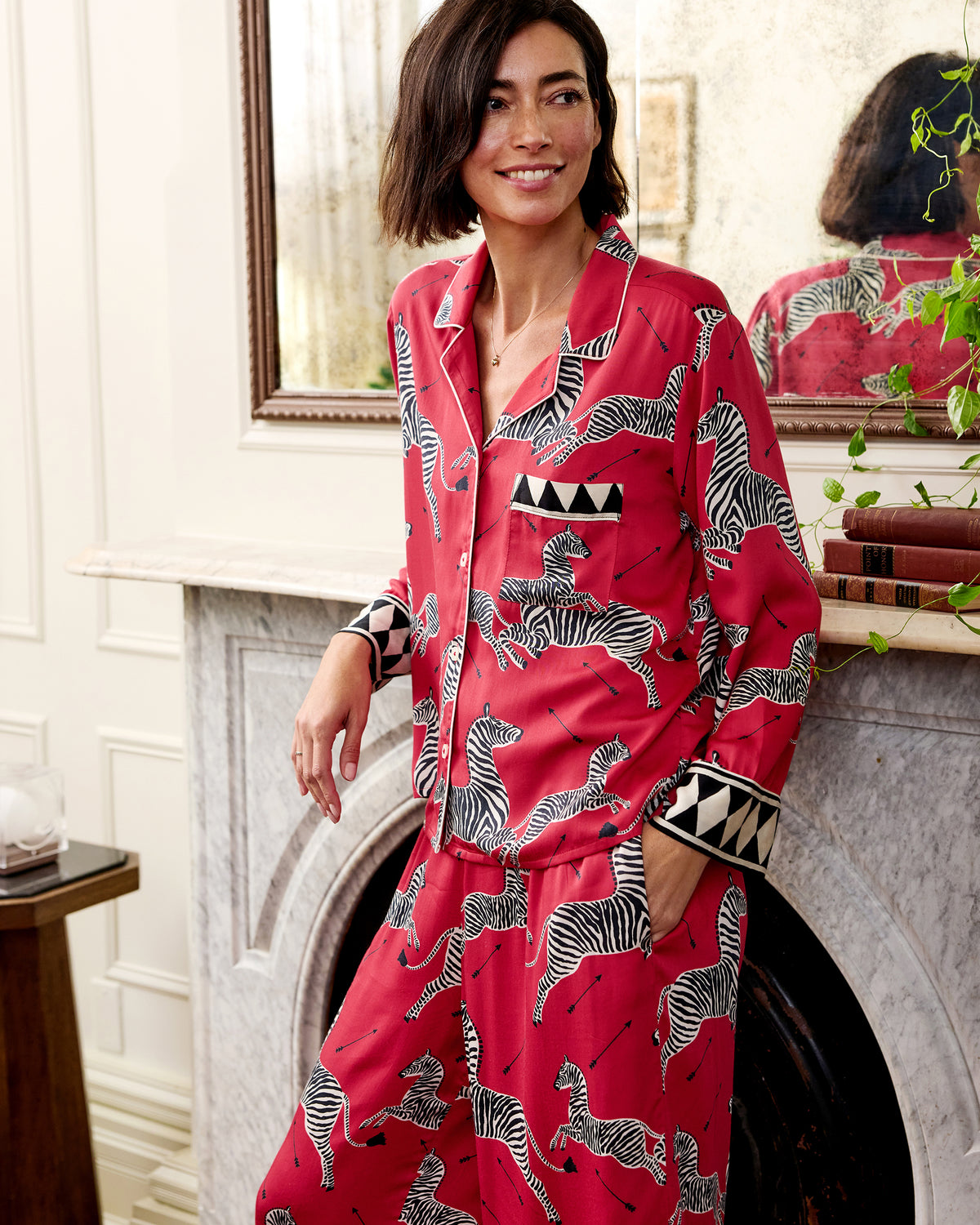 Person wearing the red zebra-print shirt and wide-leg pants from the Tall Eco Satin Soho Set, standing indoors.