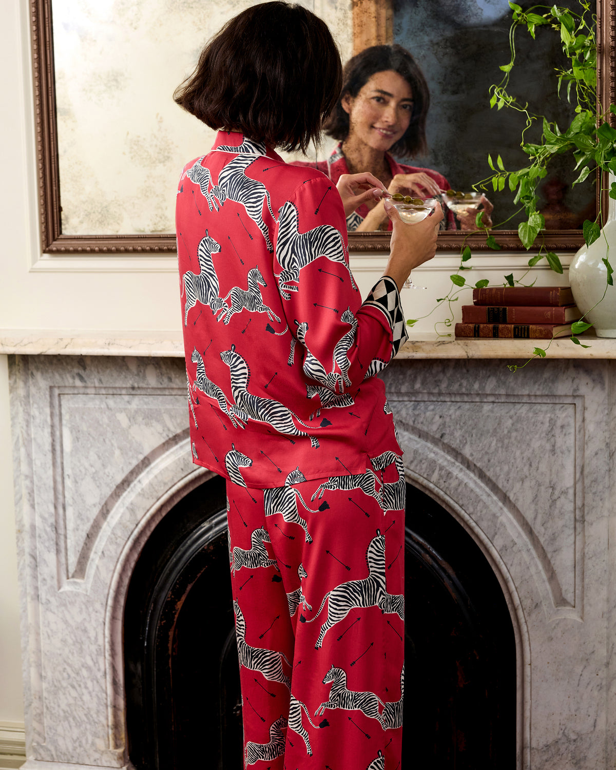 Back view of the red zebra-print shirt and wide-leg pants from the Eco Satin Soho Set.