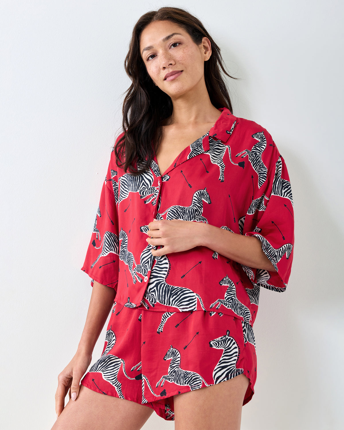 Three-quarter front view of the red zebra-print top and shorts from the Eco Satin Sweet Dreams Set.