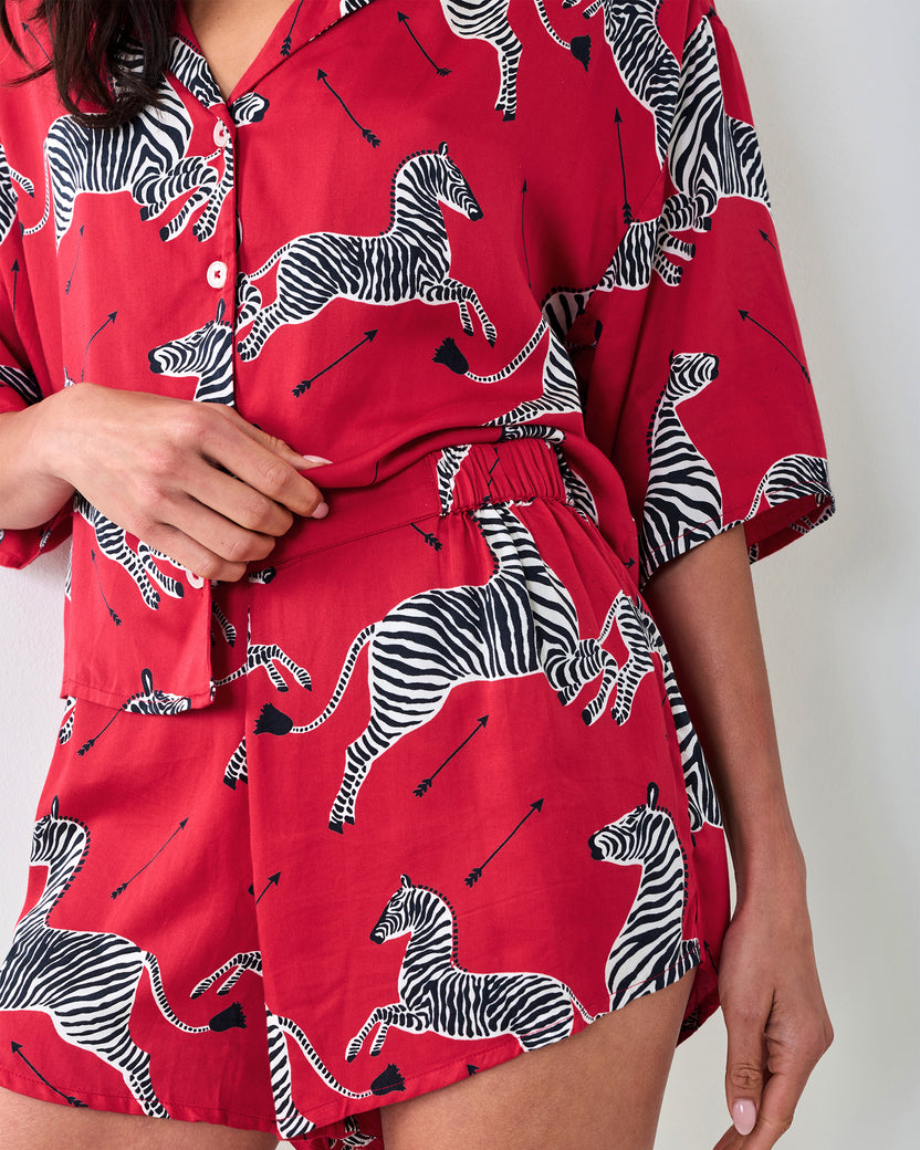 Close-up of the red zebra-print button-front top and elastic-waist shorts from the Eco Satin Sweet Dreams Set.