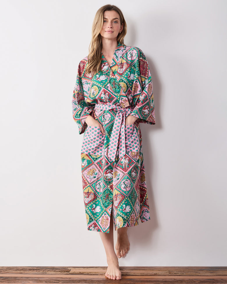 Full-length front view of a person wearing the printed long robe with a tied sash and front pockets.