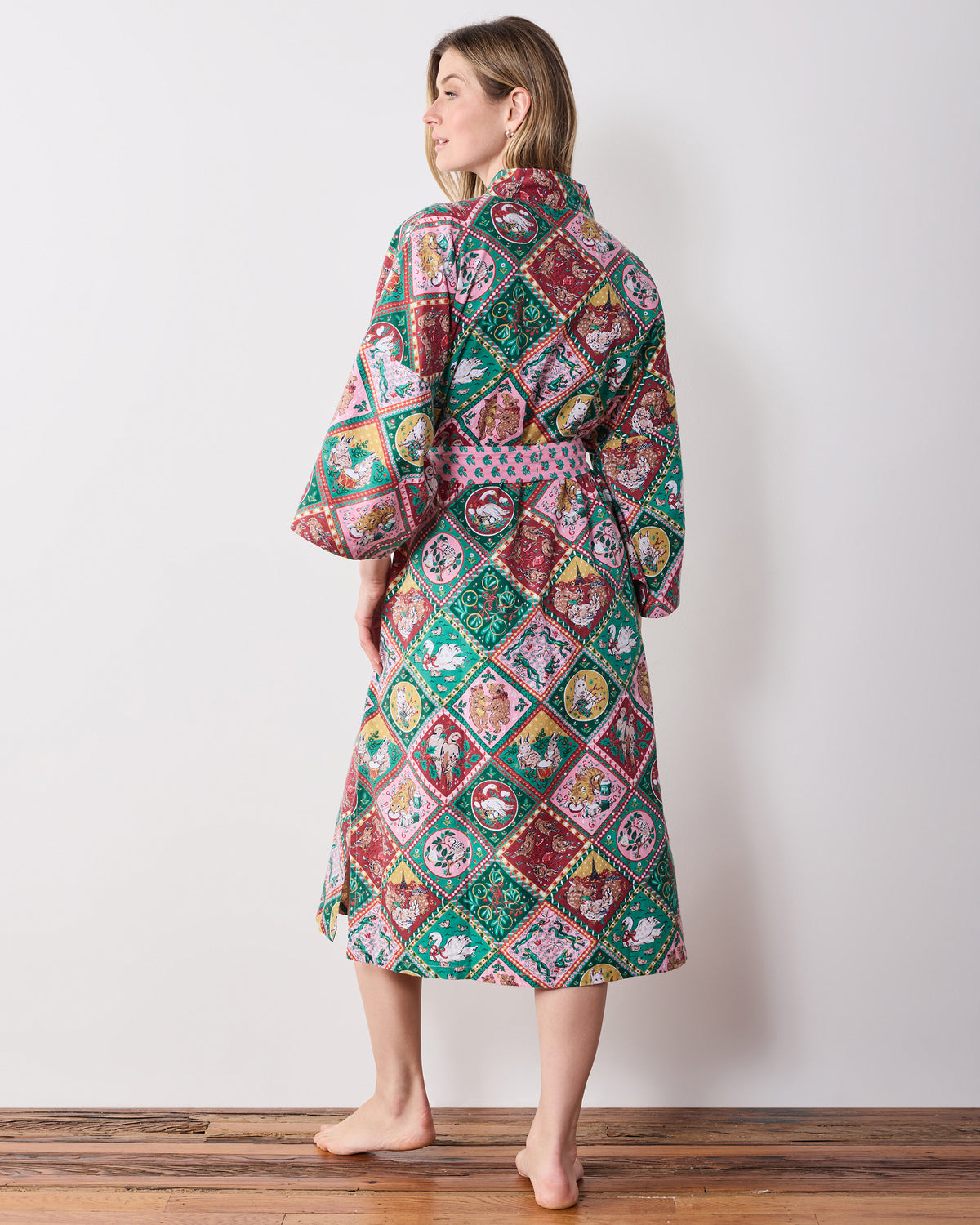 Back view of a person wearing the printed long robe, showing the full-back pattern and tied sash.