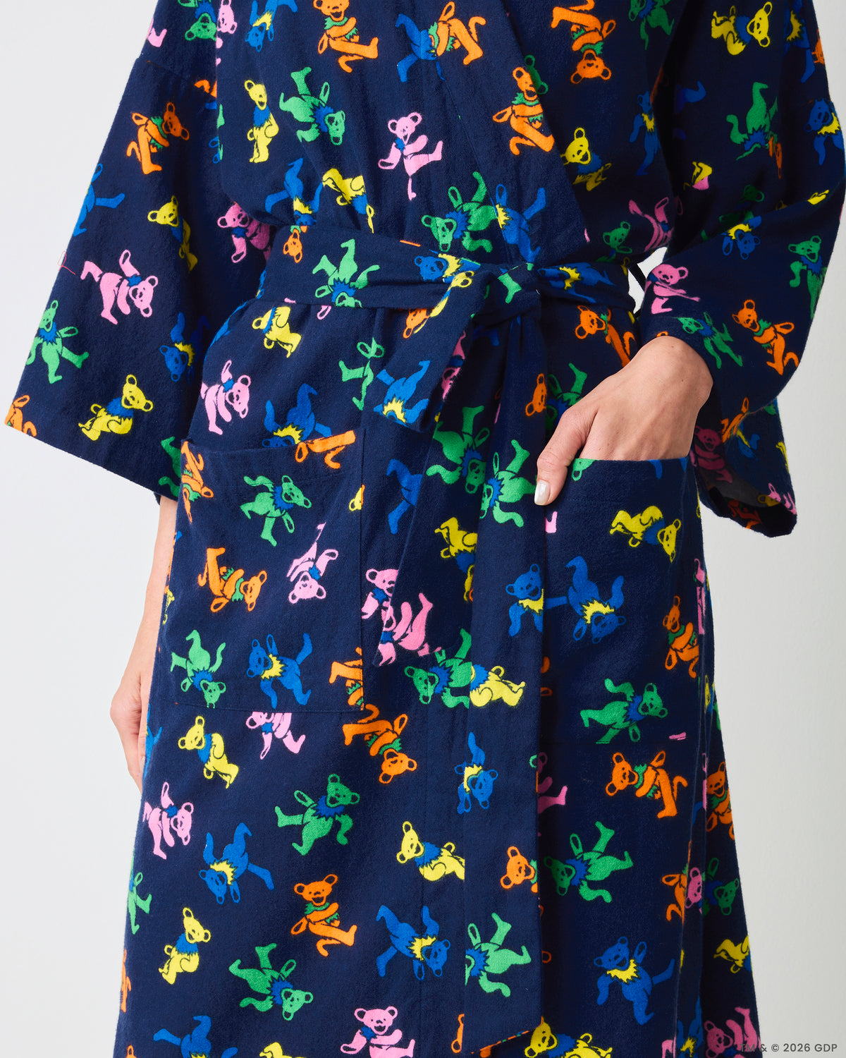 Close view of the Dancing Bears long robe showing the waist tie, front pocket, and colorful bear print.