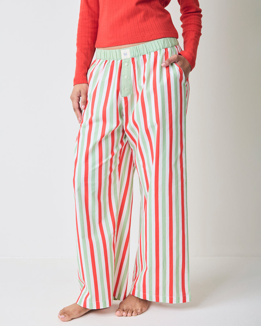 Full-length front view of Elf Stripes Nola pajama pants with vertical sage and cherry stripes, elastic waistband, pockets, and button-front fly.