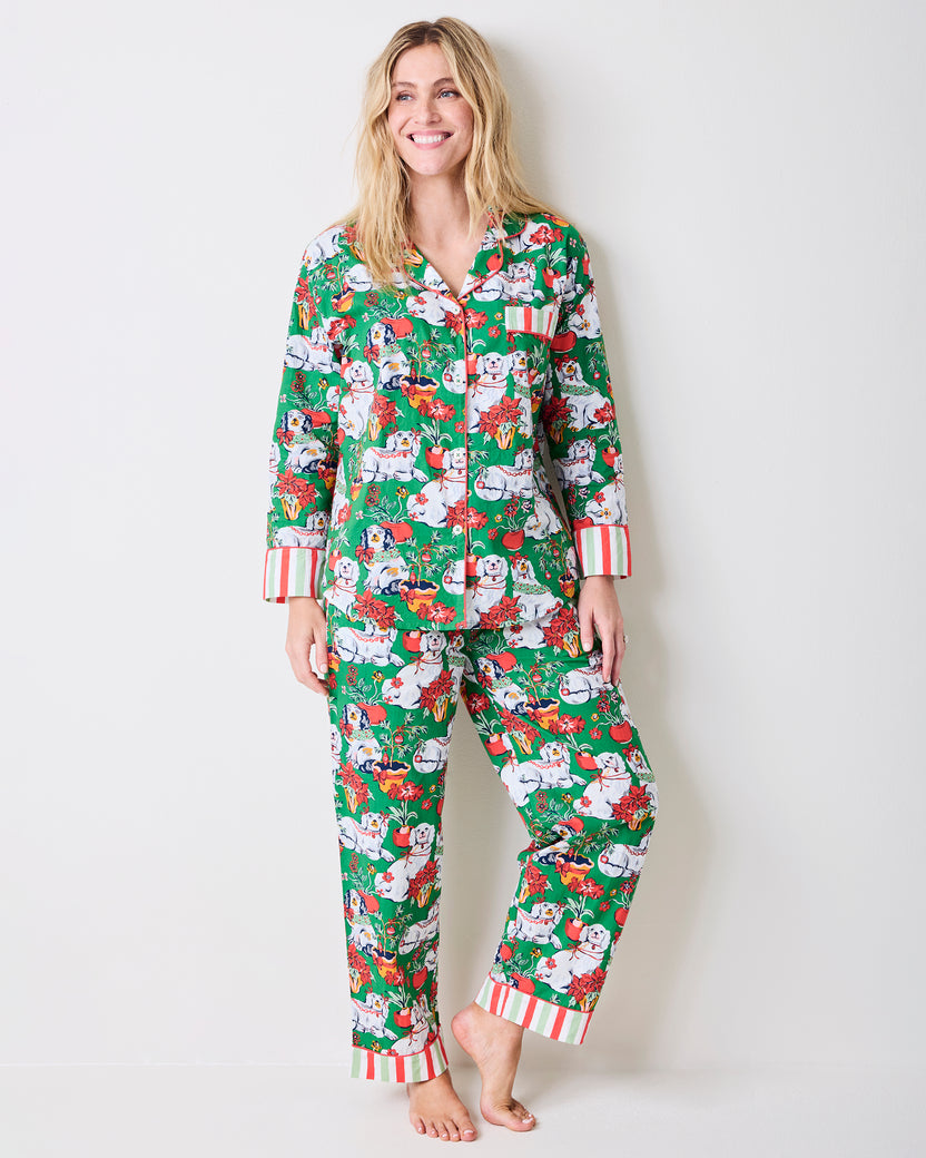 Full front view of the Good Dog Christmas long pajama set with a button-front top and full-length pants in a green dog-and-poinsettia print.