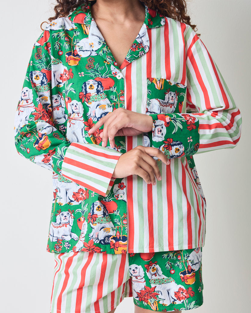 Close detail of the Good Dog Christmas boxer pajama set showing the split-print long-sleeve top, contrasting cuffs, collar, buttons, and coordinating shorts.