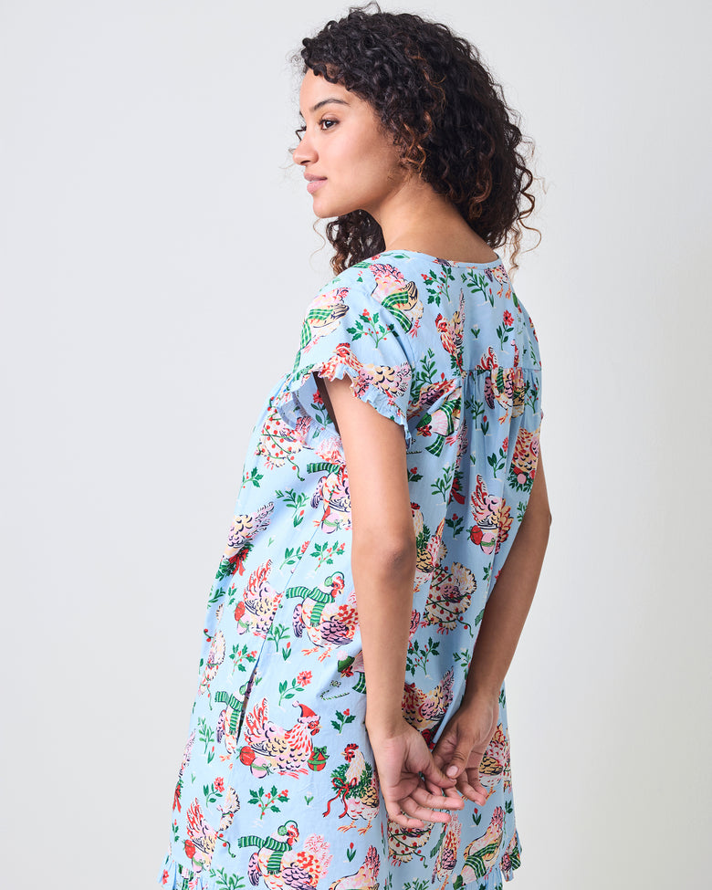 Back view of the pale blue Holiday Hens pintuck nightgown with short sleeves and all-over hen print.