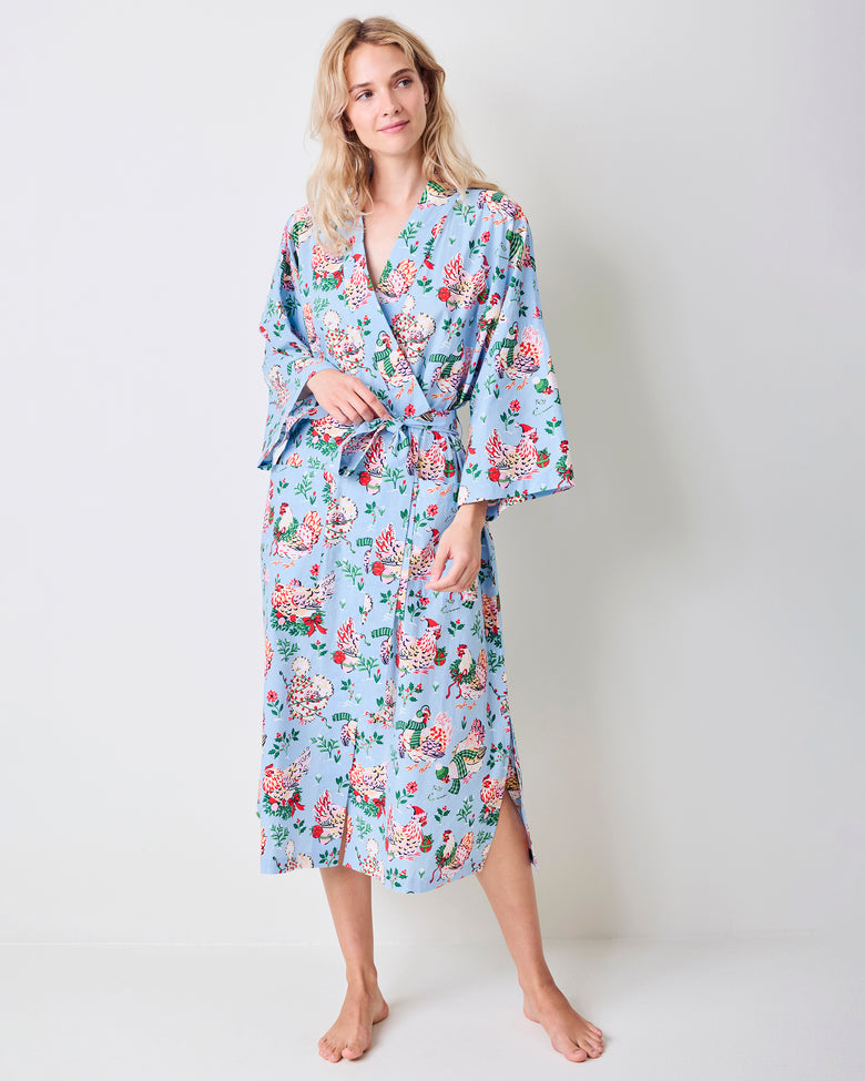 Full-length view of the pale blue Holiday Hens robe with a floral hen print, wrap front, belt, and three-quarter sleeves.