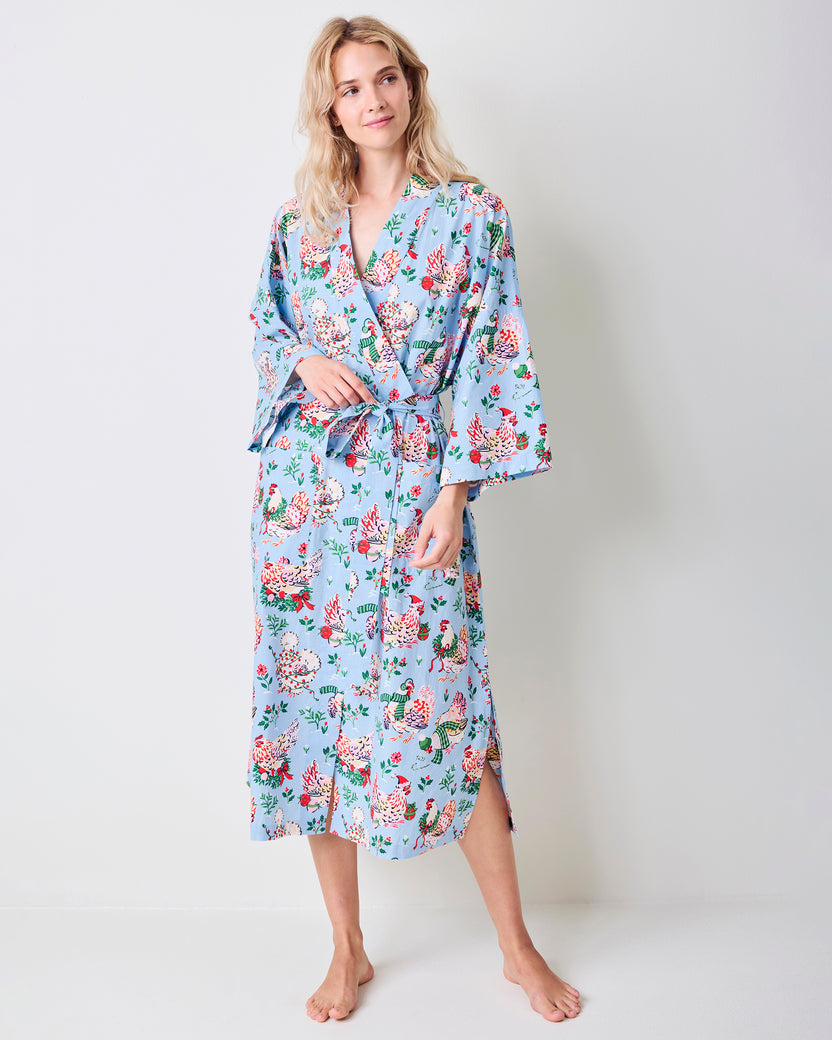 Full-length view of the pale blue Holiday Hens robe with a floral hen print, wrap front, belt, and three-quarter sleeves.