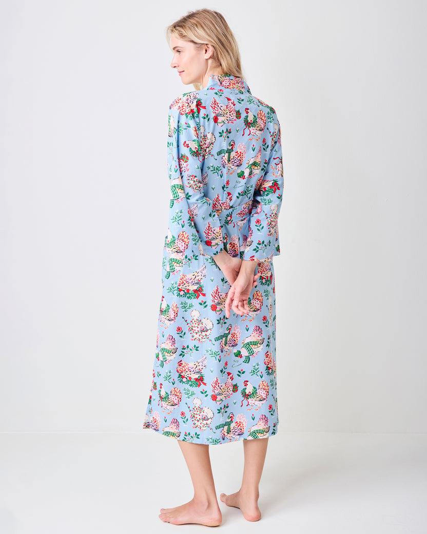 Back view of the pale blue Holiday Hens long robe, showing the full length and repeating chickens-in-winter-print pattern.