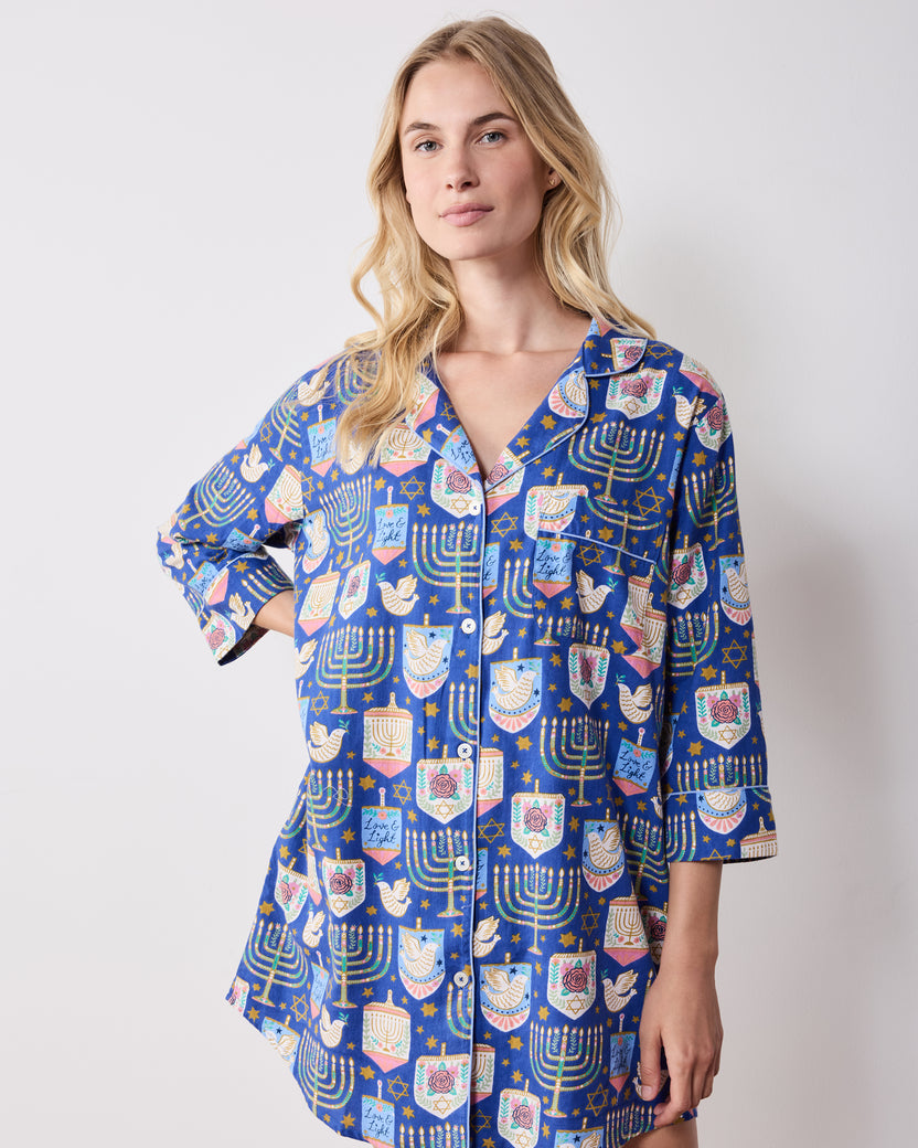 Front view of the blue patterned Love & Light sleep shirt with a notched collar, button front, long sleeves, and curved hem.
