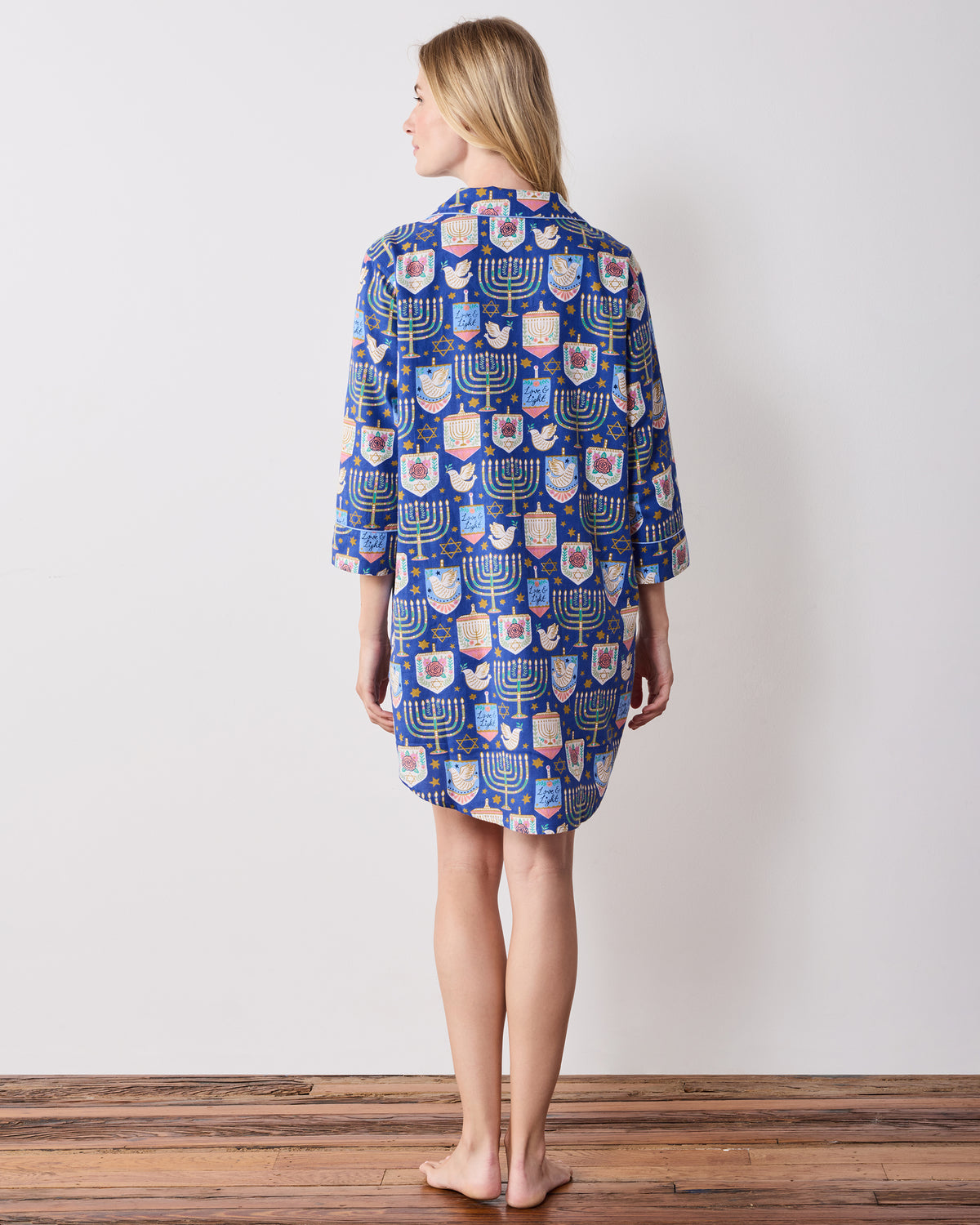 Back view of the blue patterned Love & Light sleep shirt with long sleeves and a rounded hem.