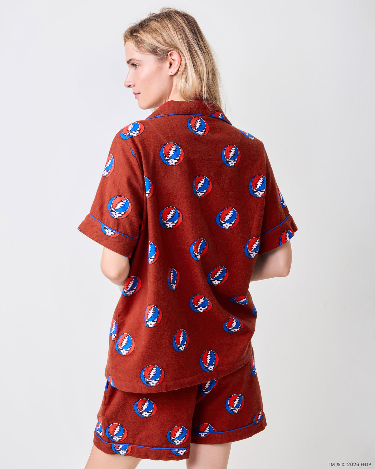 Back view of the red short-sleeve pajama set with a repeated skull-and-lightning-bolt print.
