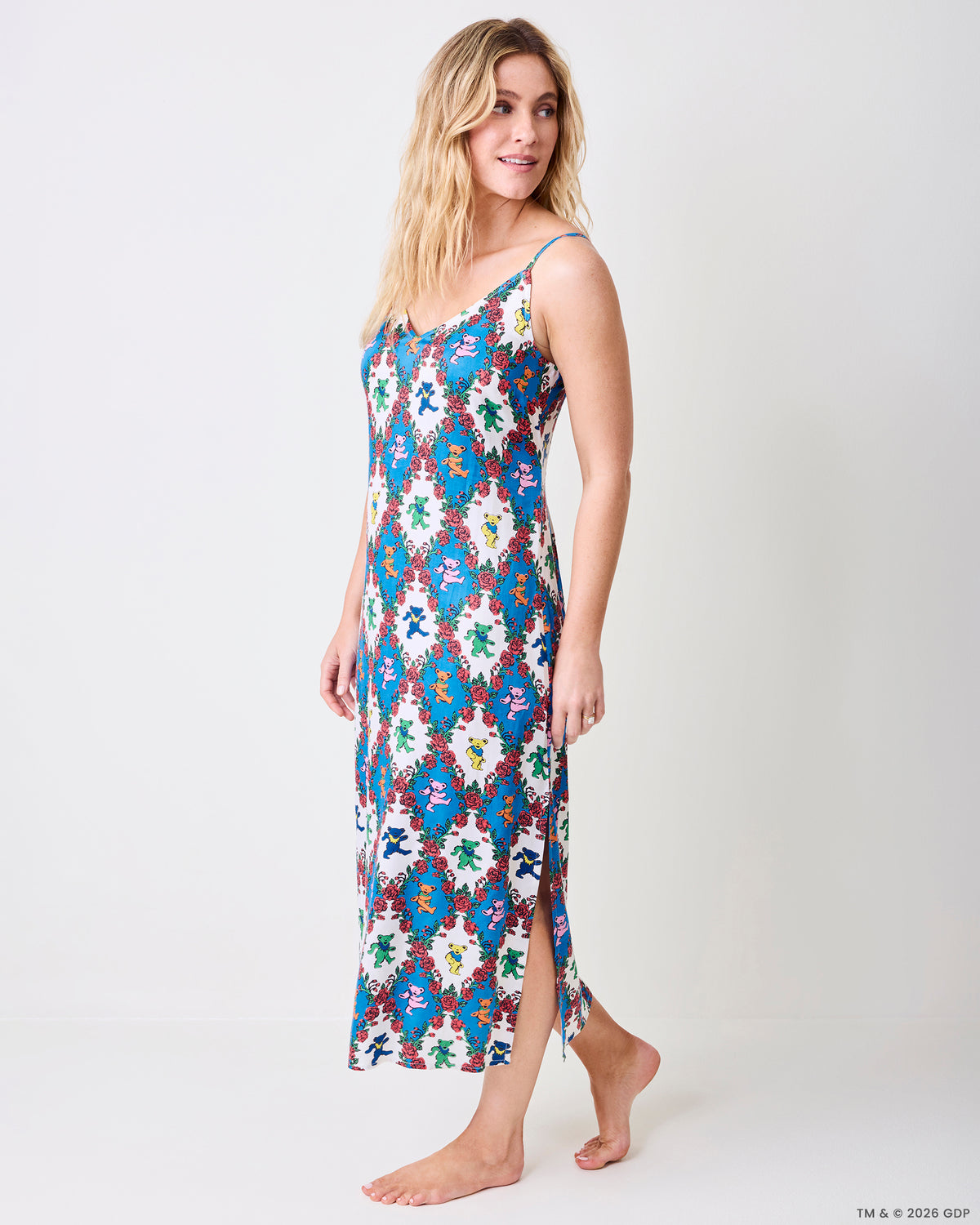 Three-quarter view of the Wandering Rose Palo Alto nightie showing the V-neckline, thin straps, side slit, and rose and dancing-bear print.