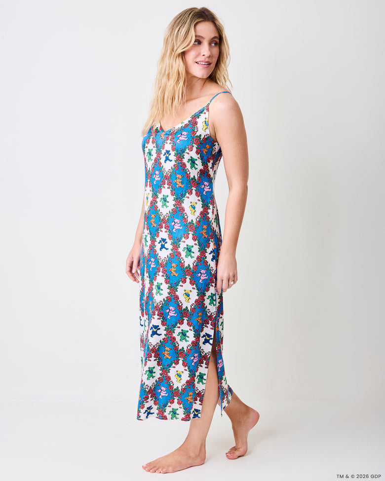 Three-quarter view of the Wandering Rose Palo Alto nightie showing the V-neckline, thin straps, side slit, and rose and dancing-bear print.