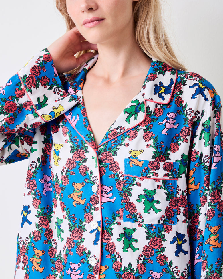 Close-up of the Wandering Rose Palo Alto Soho top showing the notched collar, button front, chest pocket, and contrasting piping.