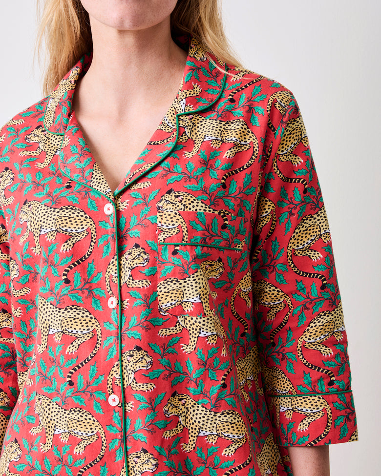 Close-up of the Ruby sleep shirt showing its collar, white buttons, chest pocket, three-quarter sleeve, and leopard-and-floral print